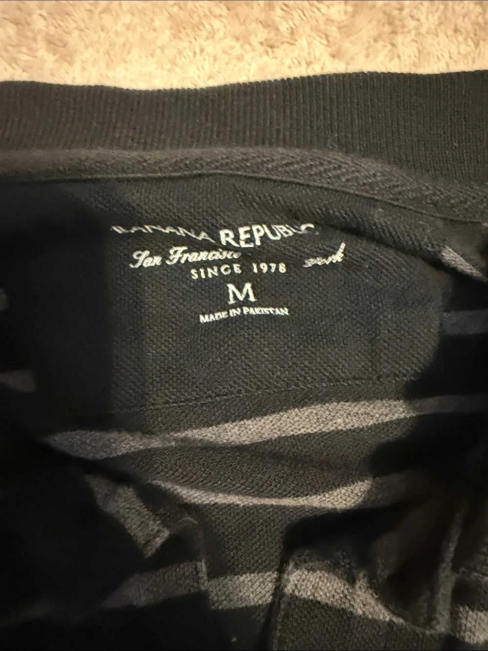 Banana Republic Black and Gray Striped Polo with Elephant Logo